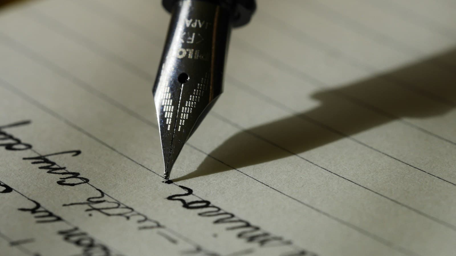 Landscape photograph of a concise printed document beside a pen and notebook on a clean research desk.